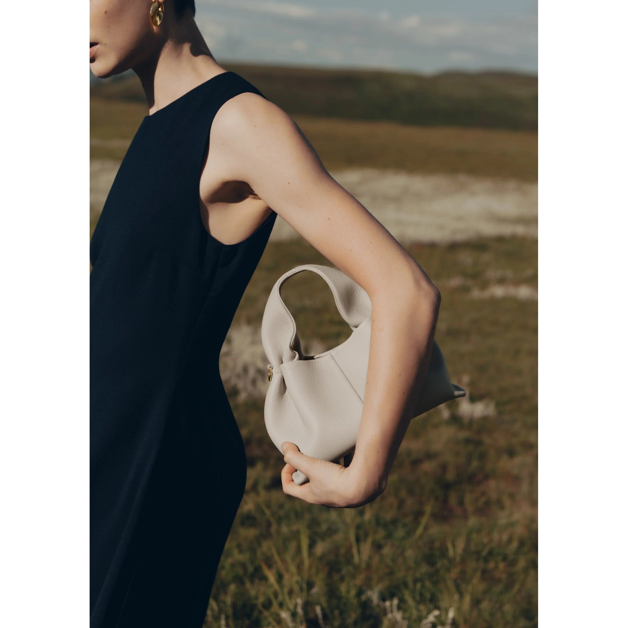 Hérita – Cremefarbene Hobo-Tasche mit Rundgriff